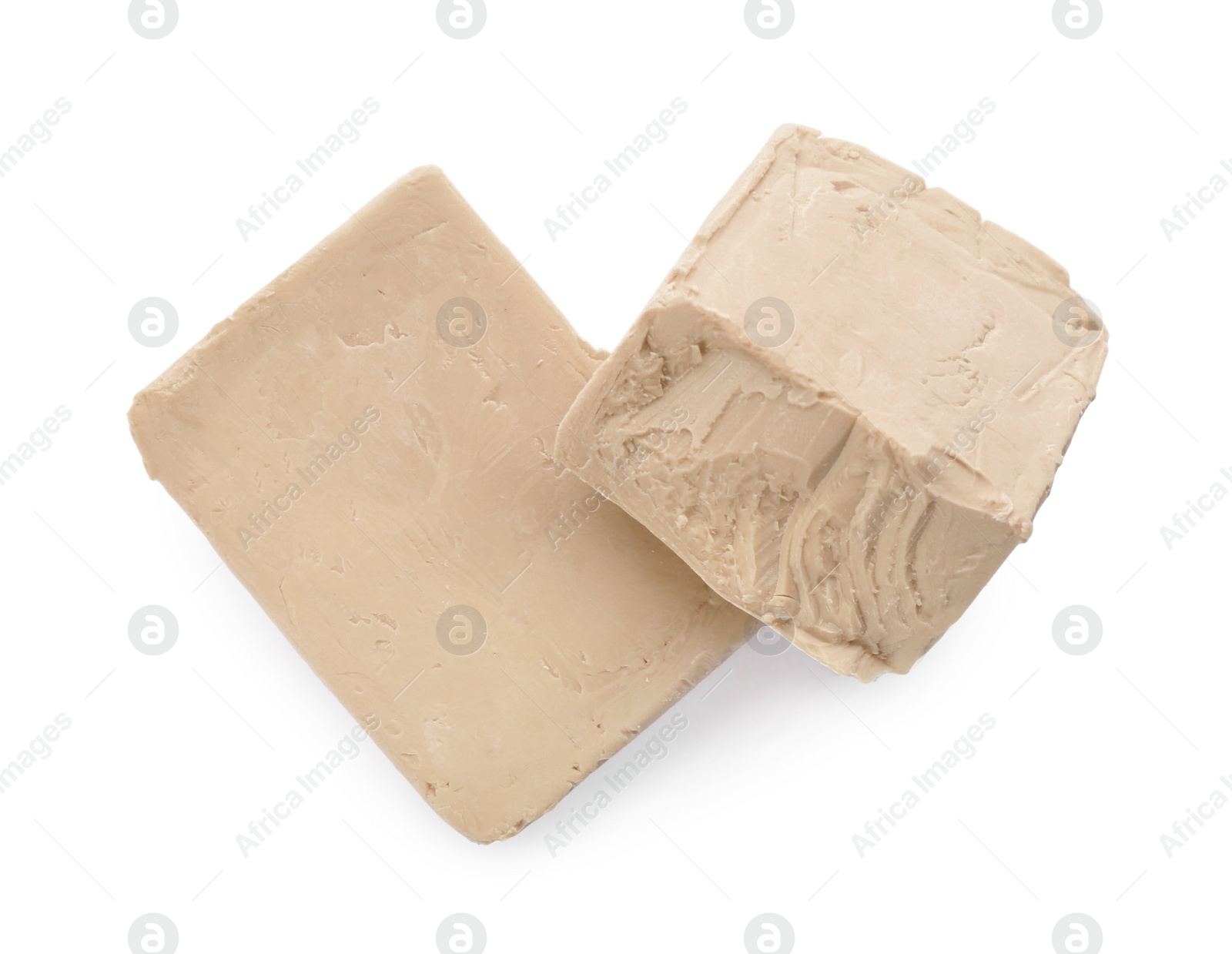 Photo of Blocks of compressed yeast on white background, top view