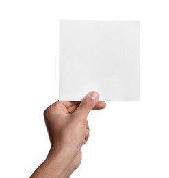 Photo of Man holding sheet of paper on white background, closeup. Mockup for design