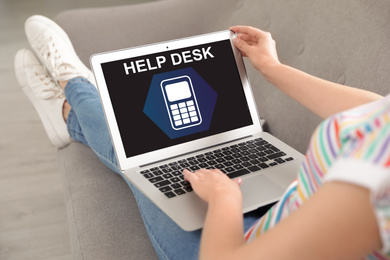Image of Woman using laptop indoors, closeup. Help desk service