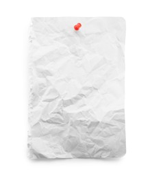 Photo of Piece of crumpled notebook sheet with pin isolated on white