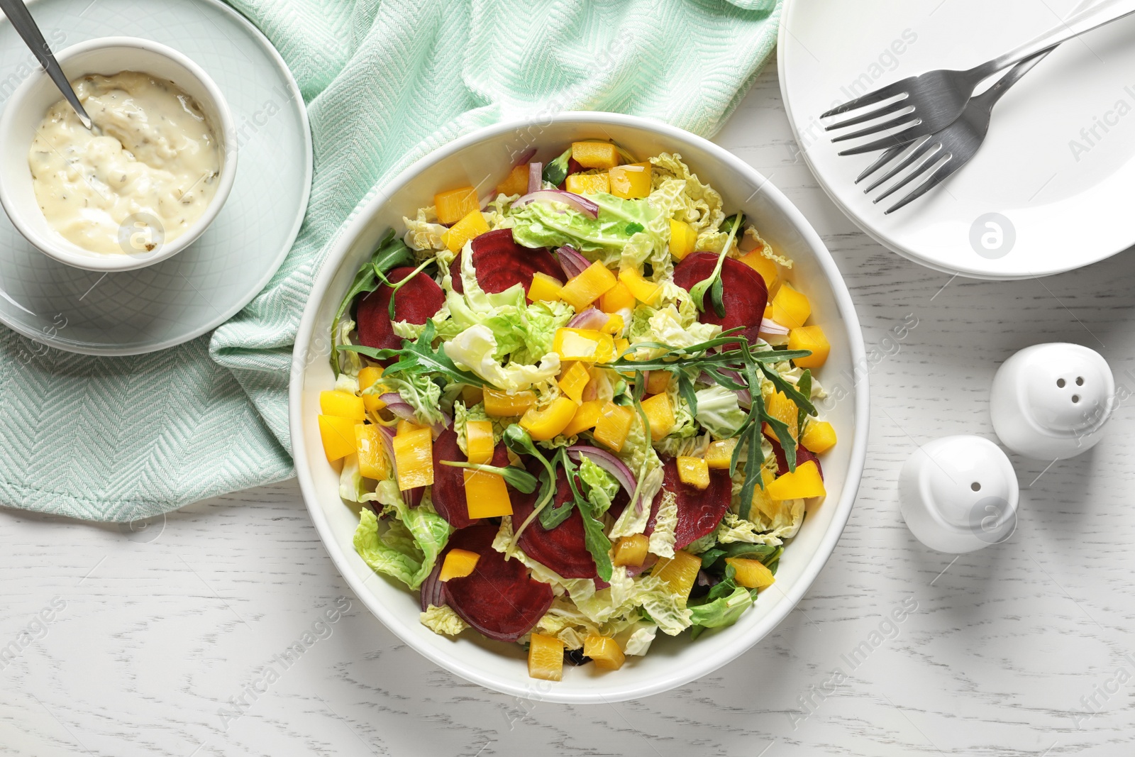 Photo of Flat lay composition with tasty beets salad on table