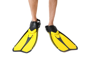 Man wearing yellow flippers on white background, closeup
