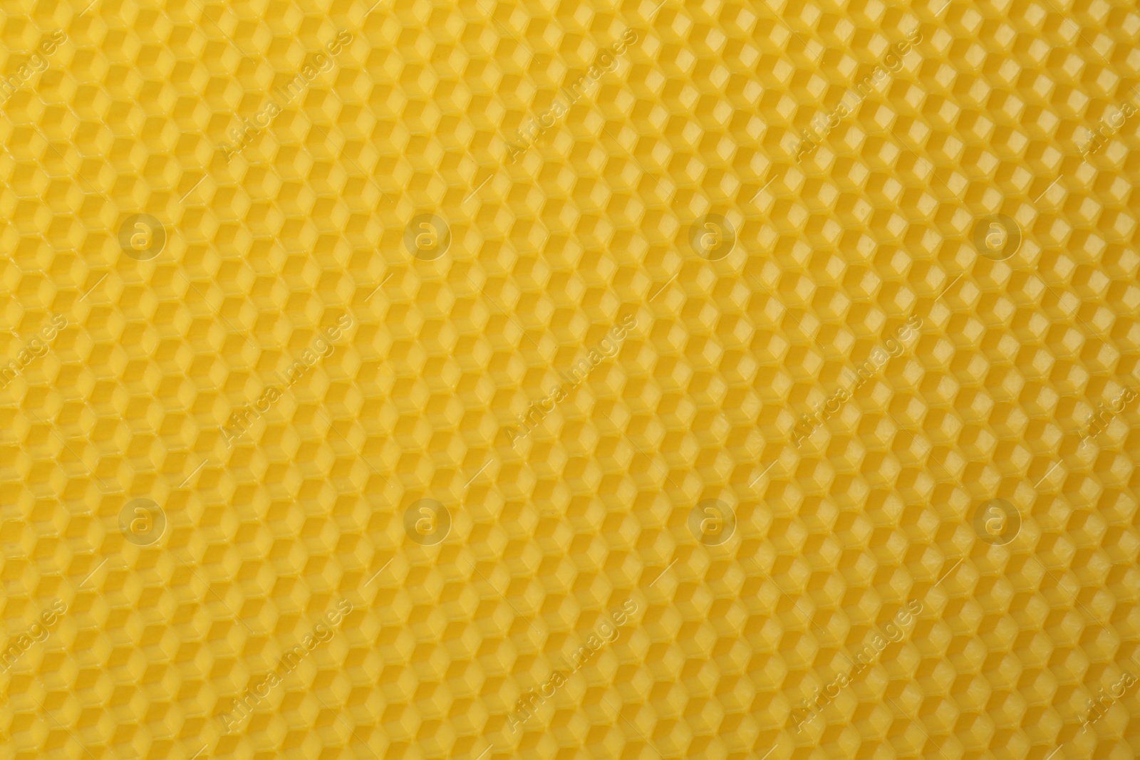 Photo of Natural beeswax sheet as background, top view