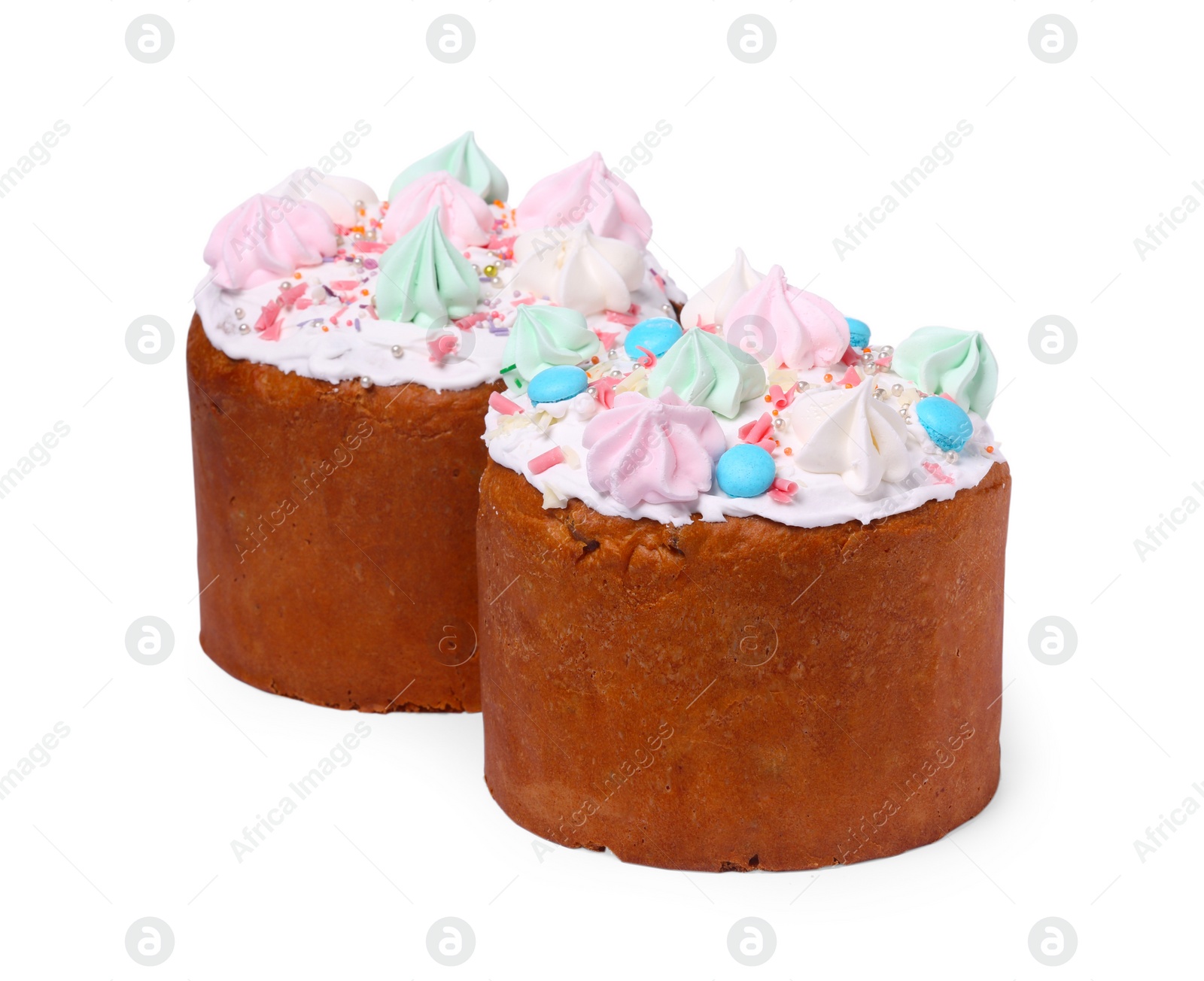 Photo of Traditional Easter cakes with sprinkles and meringues isolated on white