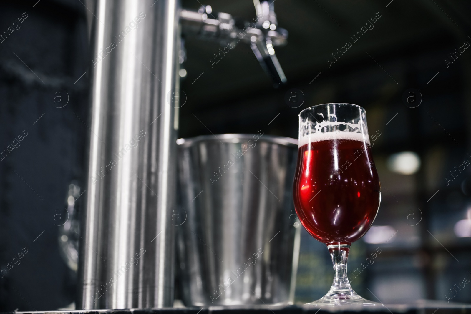 Photo of Glass of beer on bar counter in pub