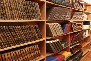 Image of Collection of different books on shelves in library