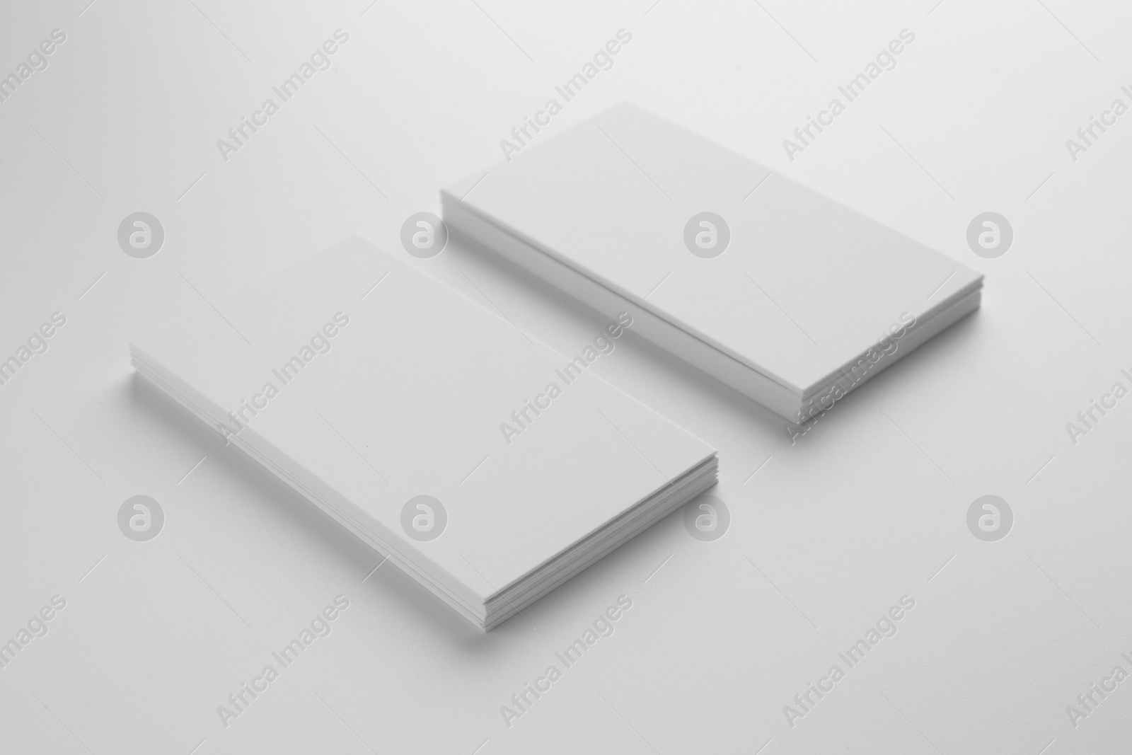 Photo of Blank business cards on white background. Mockup for design