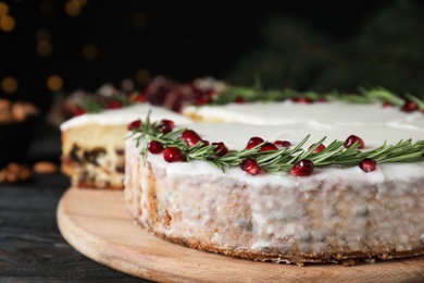 Traditional homemade Christmas cake on wooden table, closeup