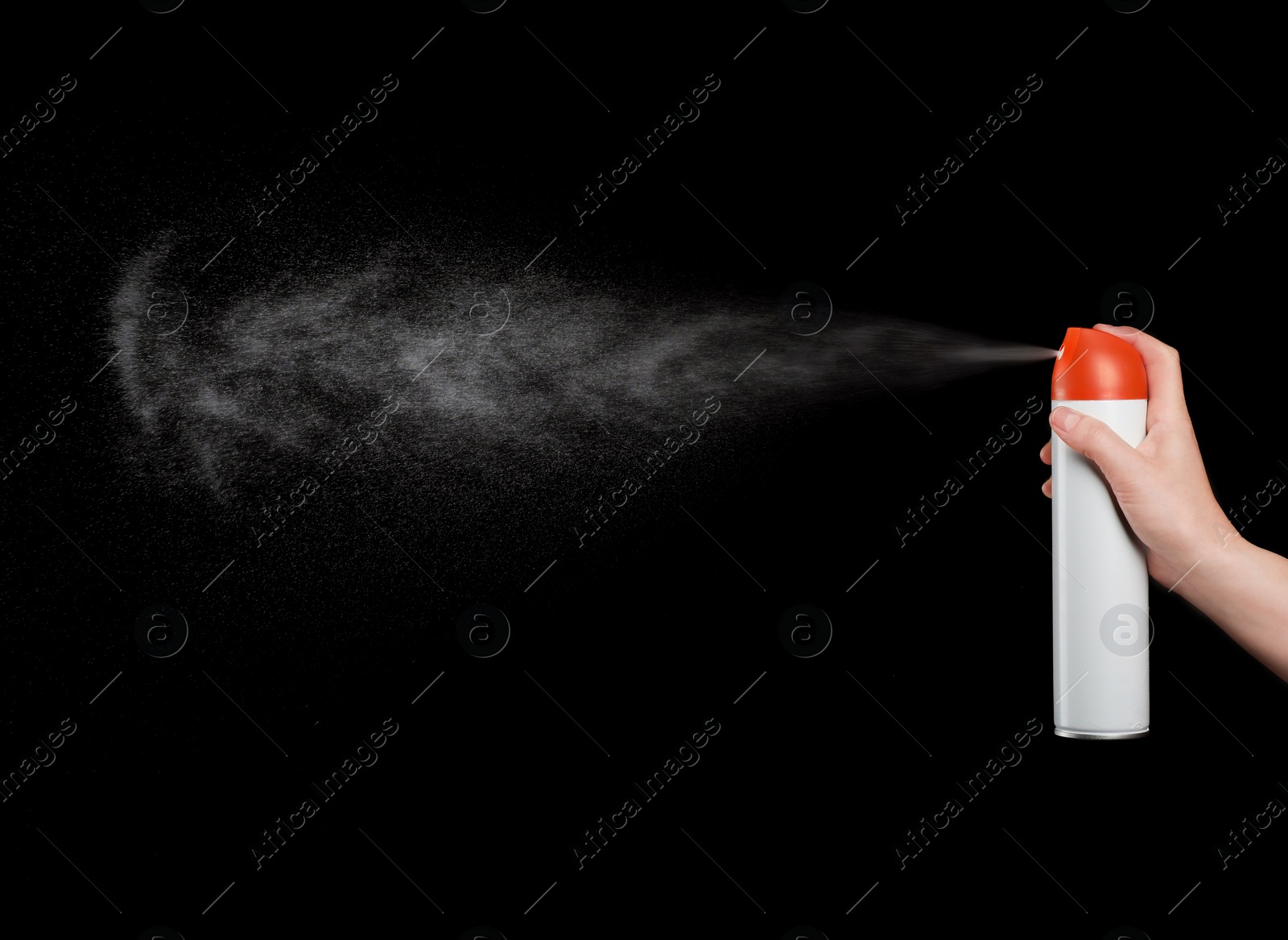 Photo of Woman spraying air freshener on black background, closeup