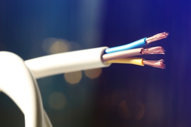 Cable with copper wires against blurred background, closeup