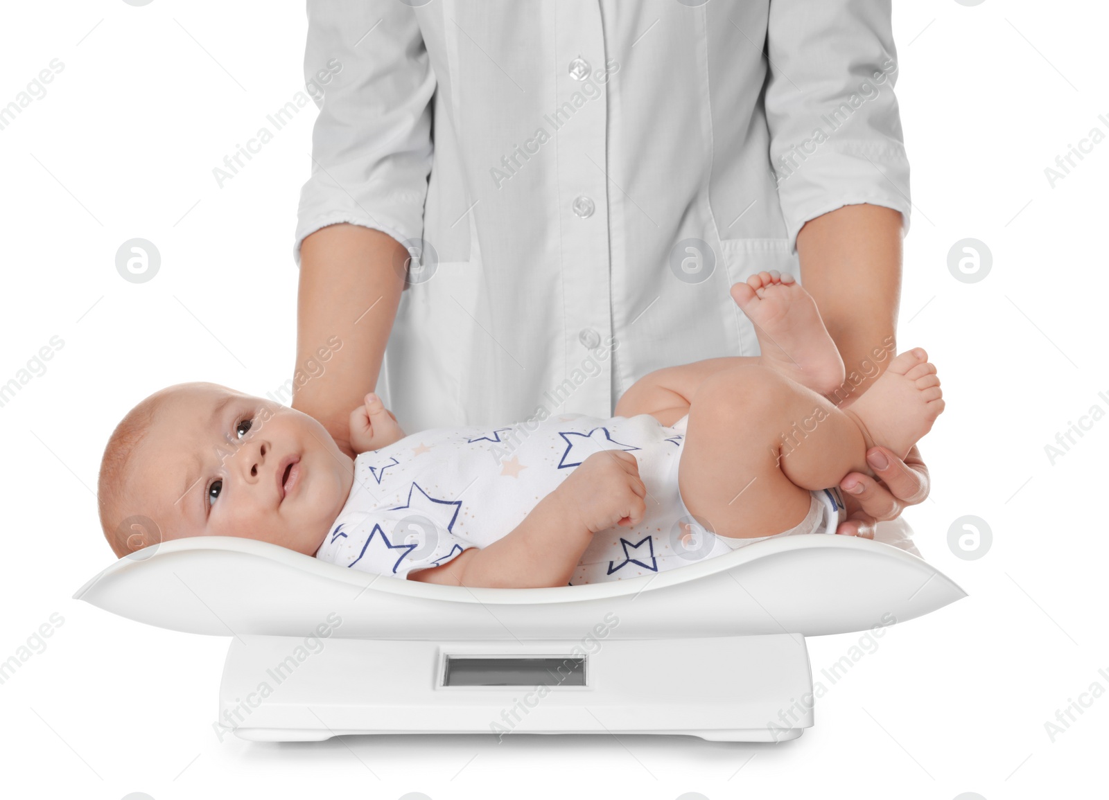 Photo of Doctor weighting baby on scales against white background