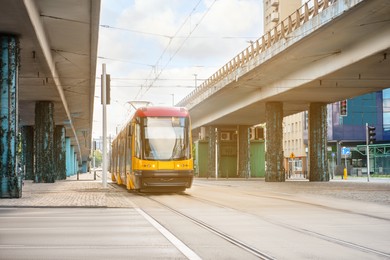 Photo of Streetcar on road in city. Public transport