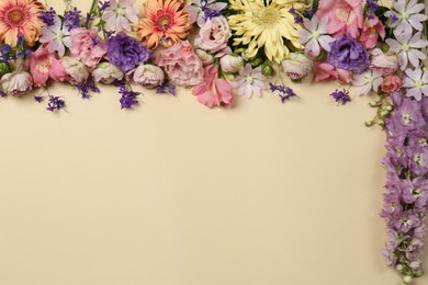 Photo of Flat lay composition with different beautiful flowers on beige background, space for text