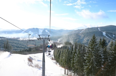 Beautiful mountain landscape with chairlift. Winter vacation