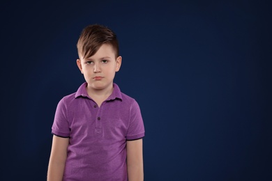 Photo of Portrait of emotional boy on color background. Space for text