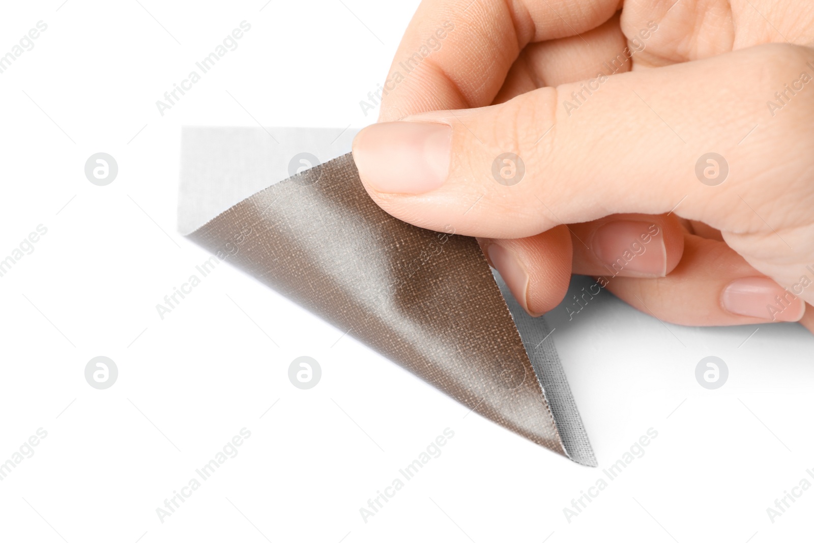Woman putting sticking plaster on white background. First aid item Photo of Woman putting sticking plaster on white background. First aid item