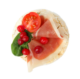 Photo of Puffed rice cake with prosciutto, berries and tomato isolated on white, top view