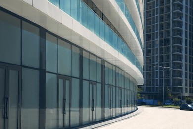 City street with modern and unfinished buildings. Construction site