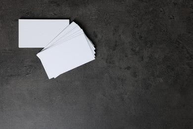 Photo of Blank business cards on grey textured background, top view. Mockup for design