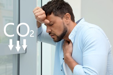 Image of Reduce CO2 emissions. Man suffering from pain during breathing near window