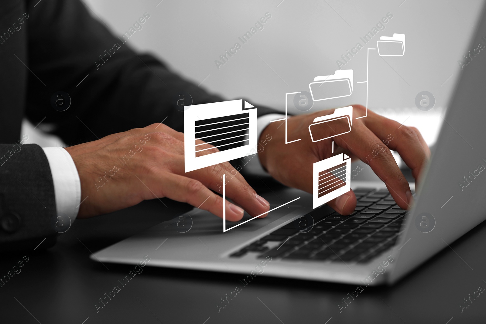 Image of File system. Businessman using laptop at table, closeup. Scheme with folders and documents over computer