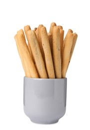 Delicious grissini sticks in cup on white background