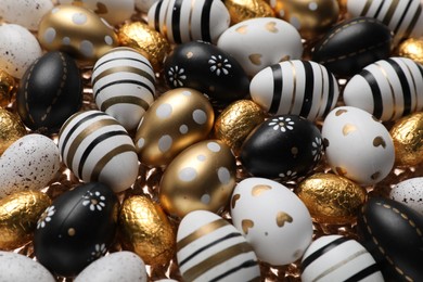 Photo of Many festively decorated Easter eggs as background