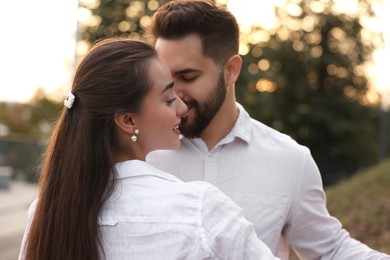 Lovely couple dancing together outdoors. Romantic date