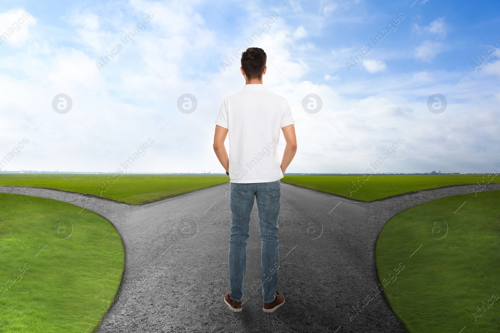 Image of Man standing at crossroads. Concept of choice between different ways 