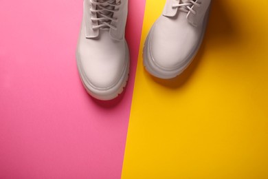 Pair of stylish leather shoes on color background, flat lay. Space for text