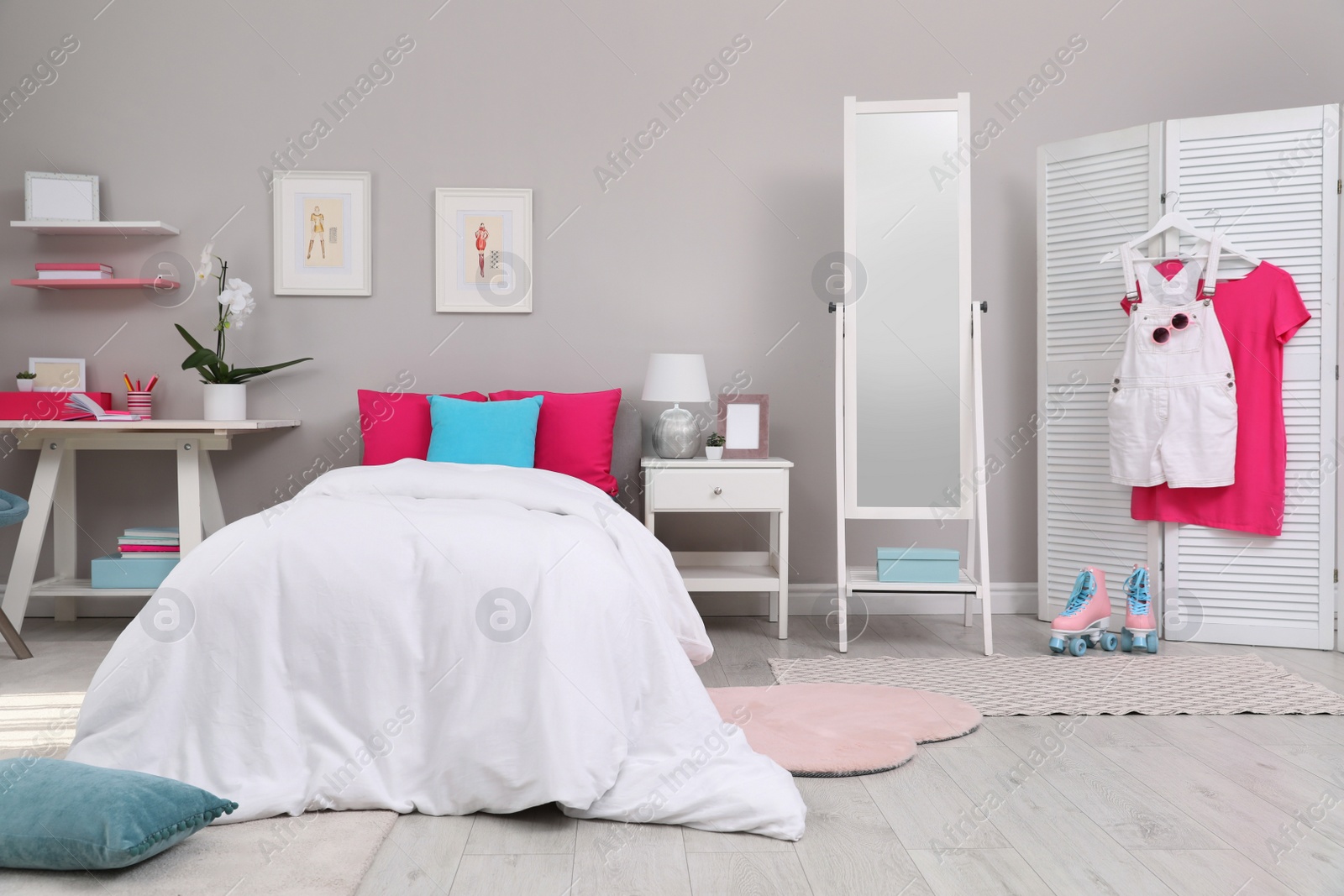 Photo of Modern teenager's room interior with comfortable bed and workplace