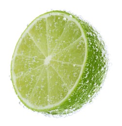Photo of Fresh lime in sparkling water on white background
