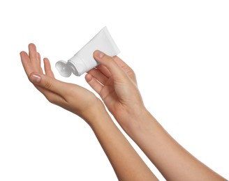 Woman applying cream on her hand against white background, closeup