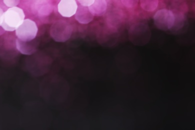 Photo of Magic pink bokeh effect on dark background