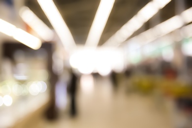 Blurred view of modern supermarket interior