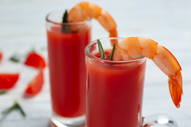 Photo of Delicious shrimp cocktail with tomato sauce, closeup