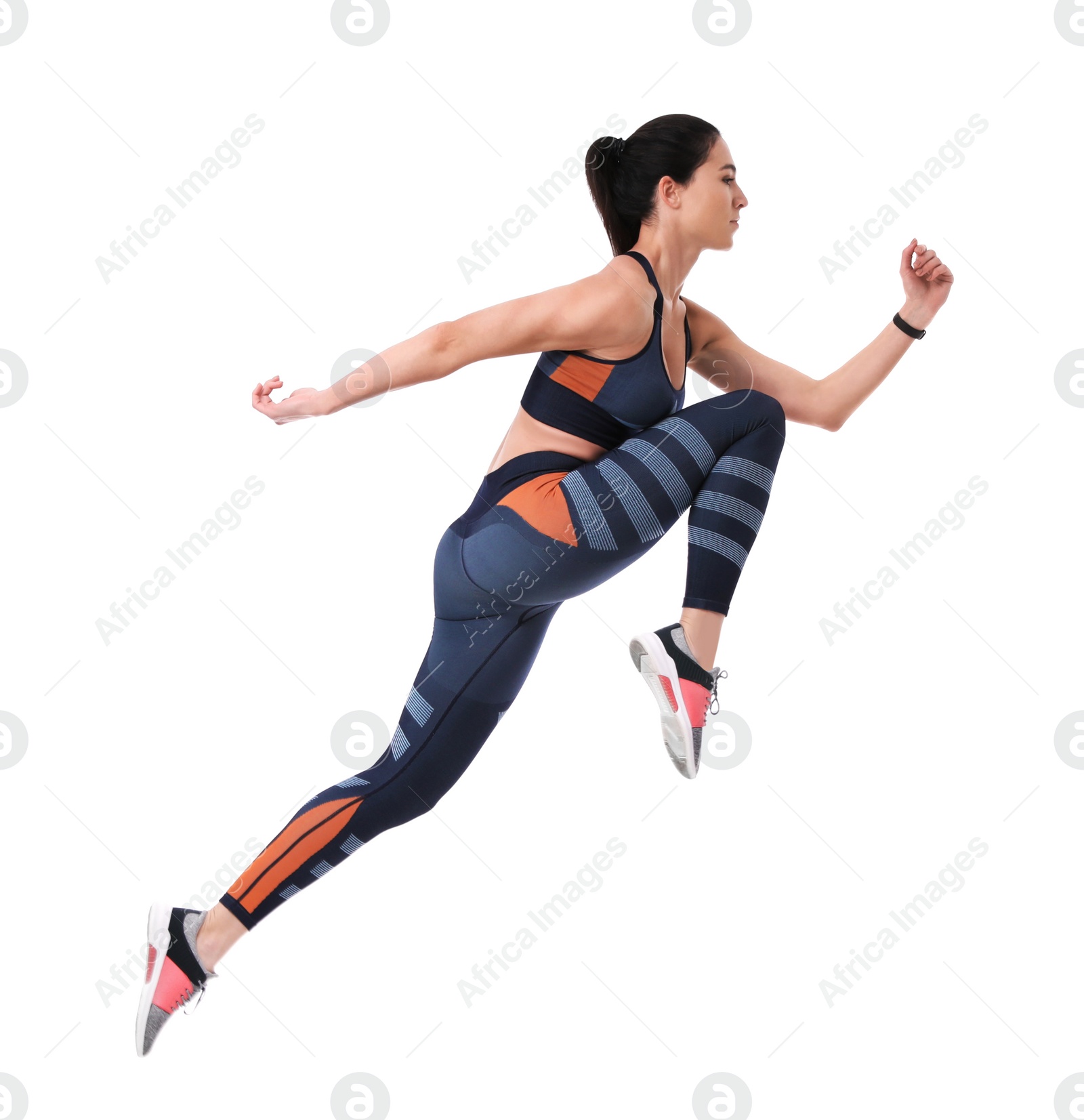 Photo of Athletic young woman running on white background, side view