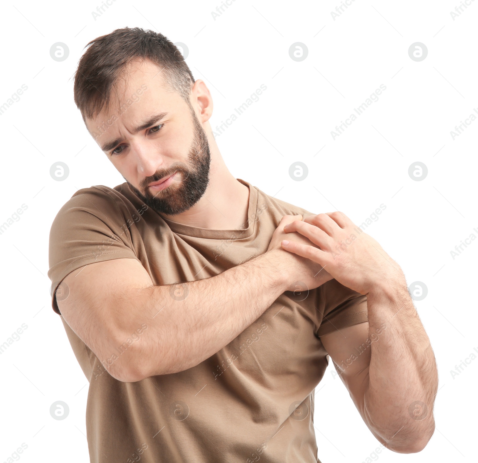 Photo of Young man suffering from pain in shoulder on white background