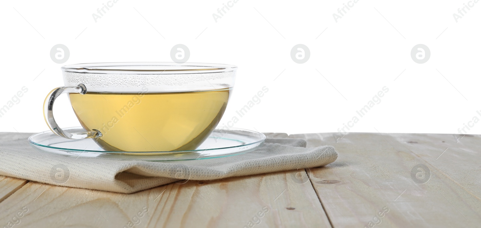 Photo of Refreshing green tea in cup on wooden table against white background