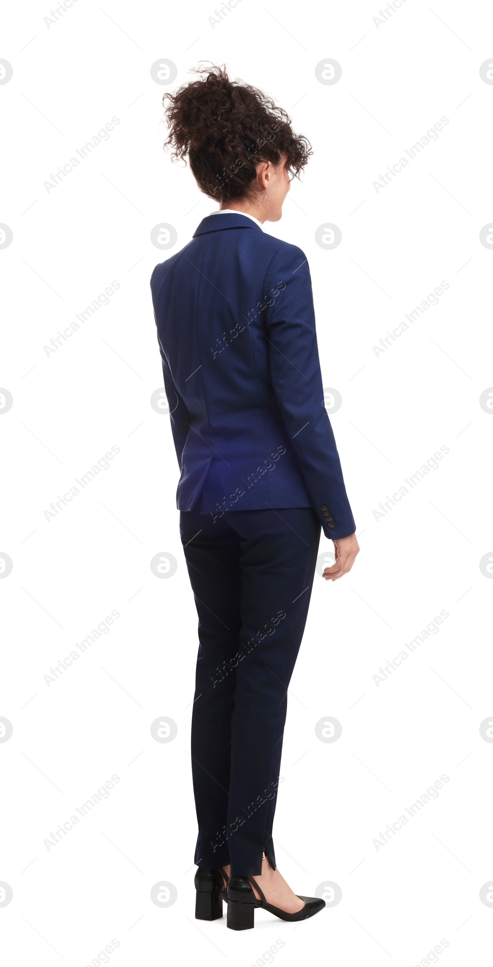 Photo of Young businesswoman in suit standing on white background