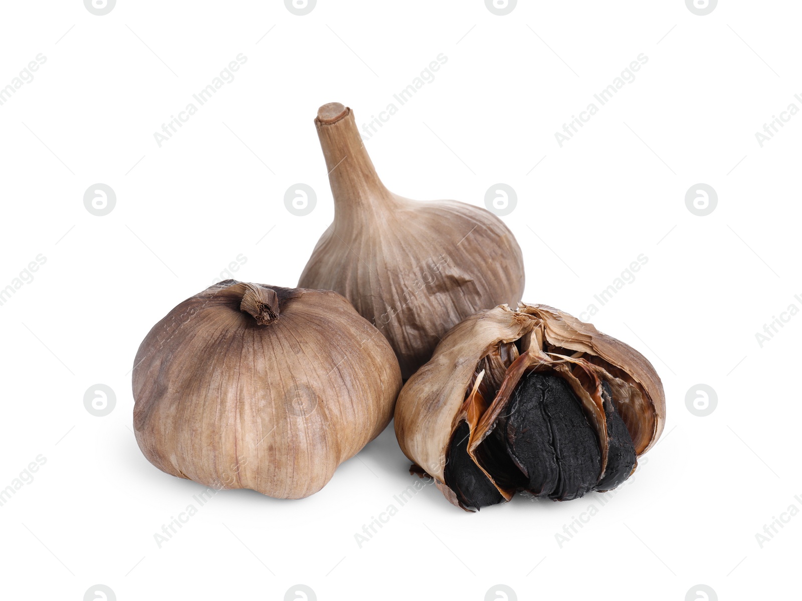 Photo of Bulbs of fermented black garlic isolated on white