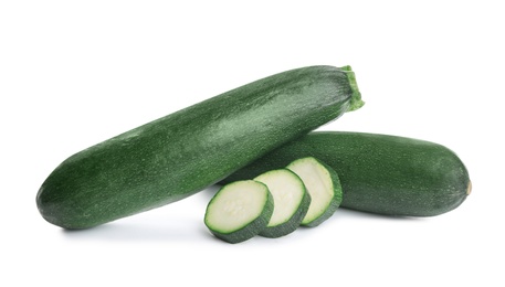 Photo of Fresh ripe green zucchinis isolated on white