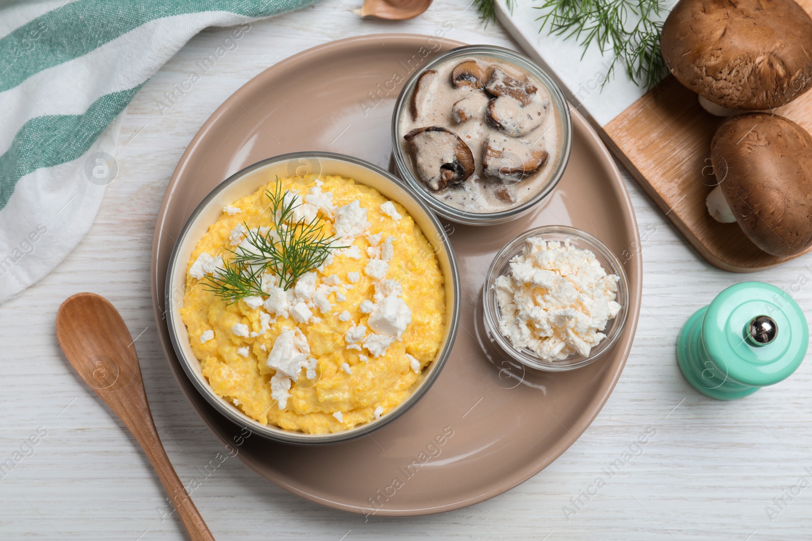 Photo of Delicious traditional banosh served on white wooden table, flat lay