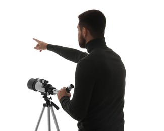 Photo of Astronomer with telescope pointing at something on white background, back view