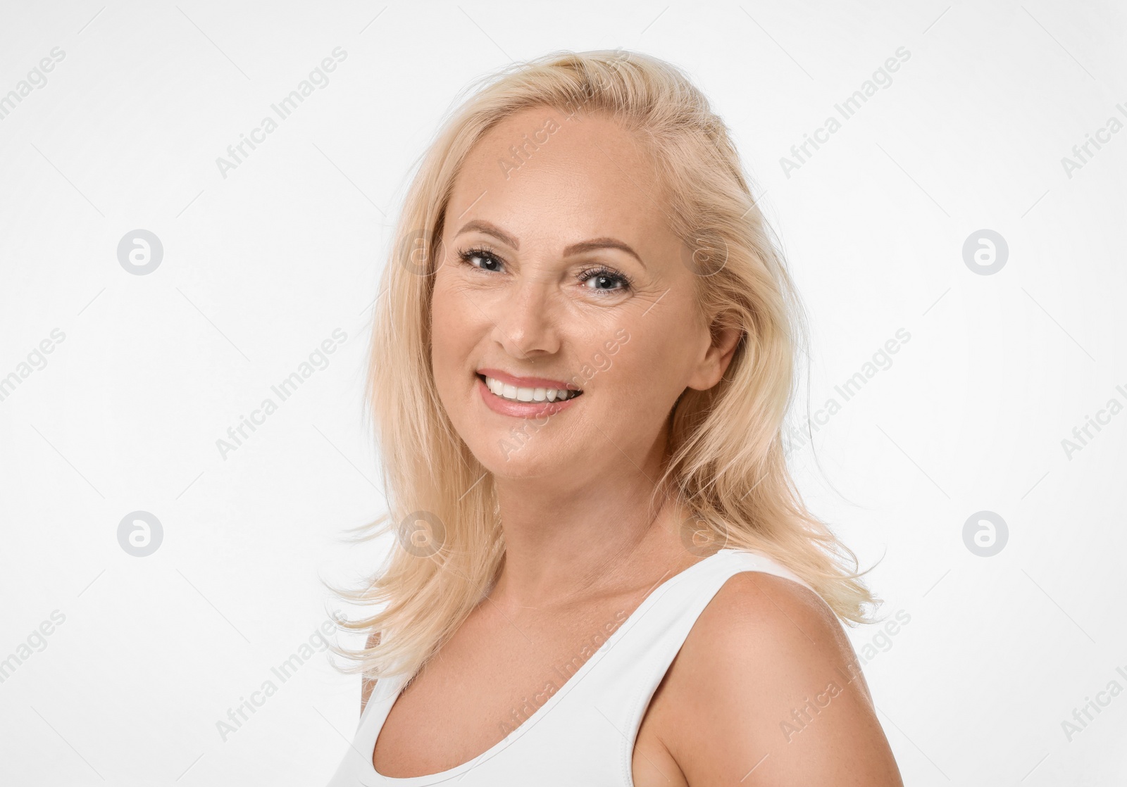 Photo of Portrait of beautiful mature woman with perfect skin on white background