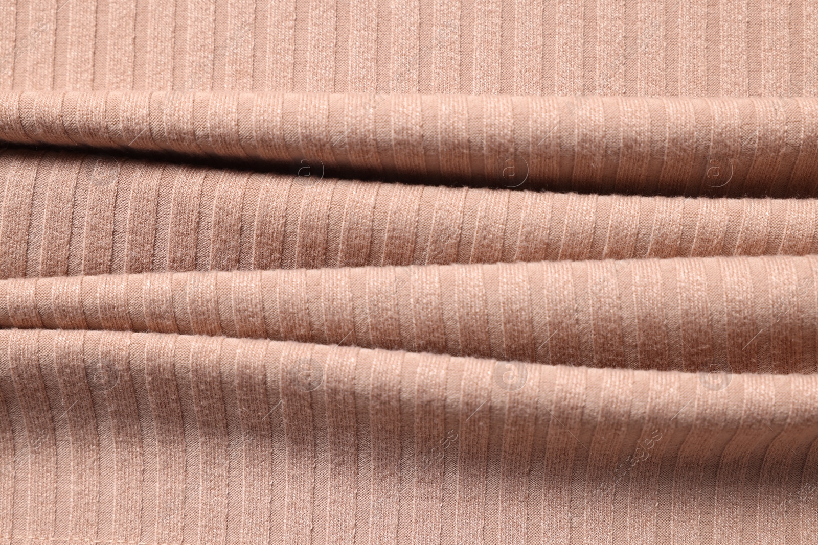 Photo of Texture of beige fabric as background, top view