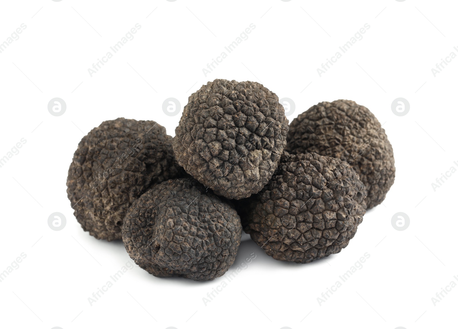 Photo of Fresh whole black truffles isolated on white