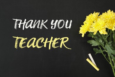 Image of Phrase Thank You Teacher, beautiful flowers and chalk on blackboard, flat lay