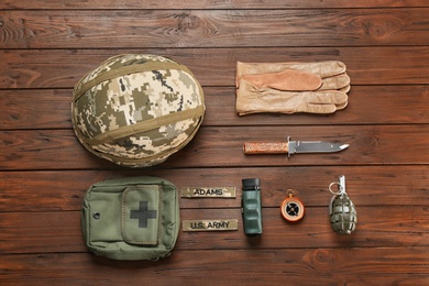 Set of military equipment on wooden background, flat lay