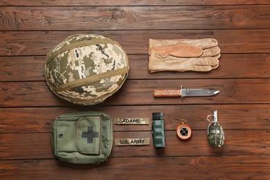 Photo of Set of military equipment on wooden background, flat lay